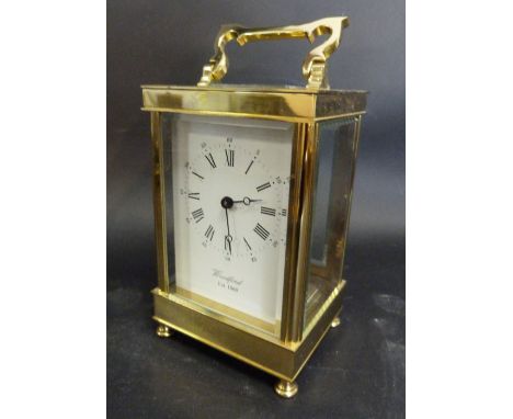 A 20th Century Brass Cased Carriage Clock, the enamel dial with Roman and Arabic numerals and inscribed Woodford, established