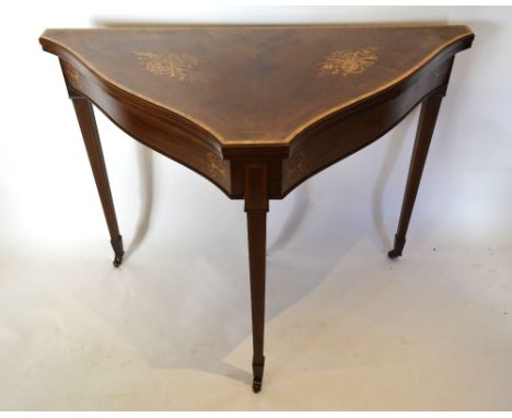 An Edwardian Mahogany Marquetry and Satinwood Inlaid Card Table of Triangular Serpentine Form, the hinged top enclosing baize