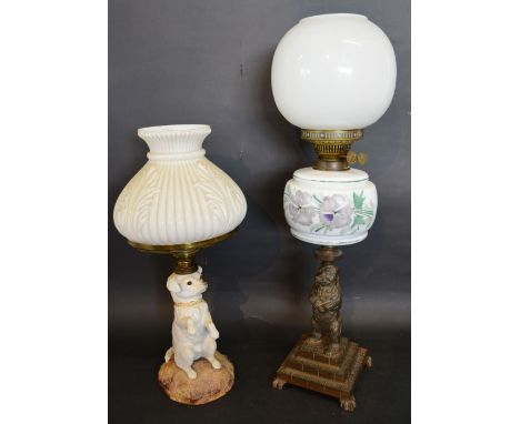 A Victorian Oil Lamp in the form of a Dog, together with another similar Victorian oil lamp