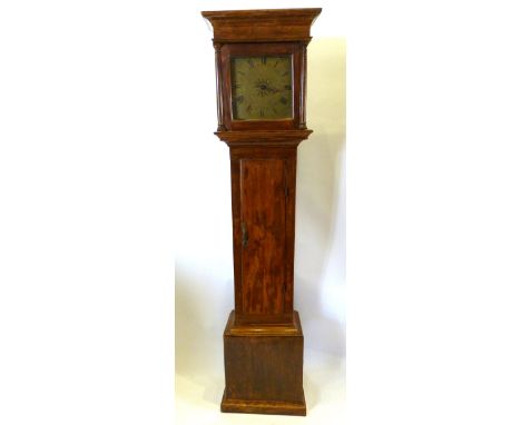 A George III Pine Long Case Clock, the square hood above a rectangular panel door and conforming plinth base, the brass dial 