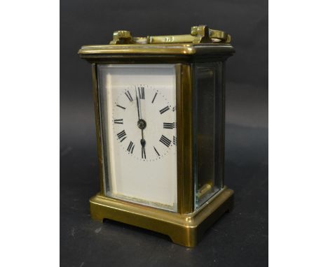 A 19th Century French Brass Cased Carriage Clock with lever escapement, the enamel dial with Roman numerals