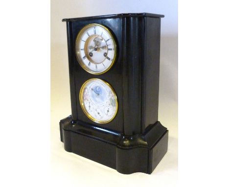 A Victorian Black Slate Clock/Calendar with two dials, the first enamel dial with visible escapement and two train movement a