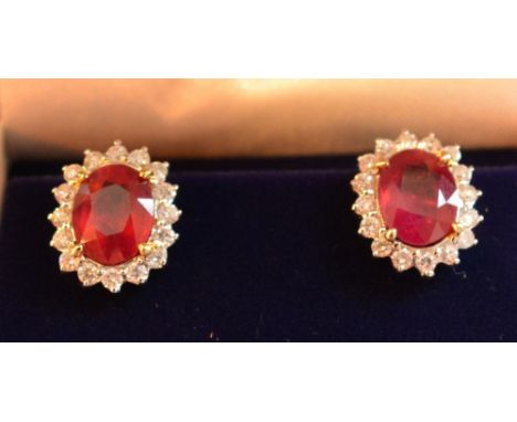 A Pair of 18ct White Gold Ruby and Diamond Custer Ear Studs, 5.40ct/0.80ct