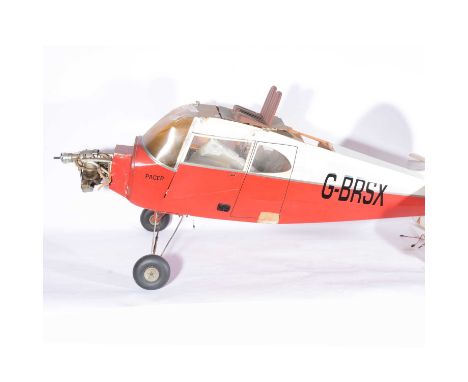 Piper Pacer flying aircraft model, red body 'G-BRSA' with OS FS-120 engine.
