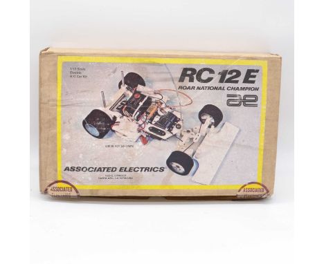 Associated Electrics, USA, RC radio control racing model kit #3030 RC 12E Road National Champion, 1:12 scale, started but wit