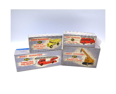 Dinky Supertoys die-cast models, four including ref 965 Euclid rear dump truck; ref 955 fire engine with extending ladder; re