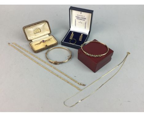 EDWARDIAN BANGLE, in nine carat gold, along with another later bangle, unmarked, a pair of gem set earrings and chains