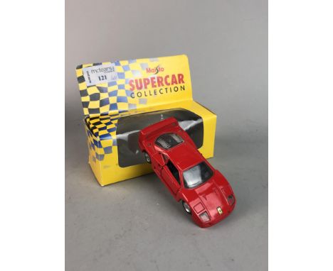 NINE DIE CASE MODEL CARS, each in box, including Maisto examples