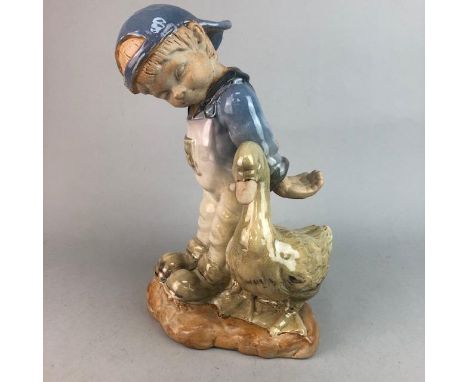 LARGE CERAMIC FIGURE OF A BOY AND SWAN, 37cm high, along with a ceramic planter, 34cm diameter
