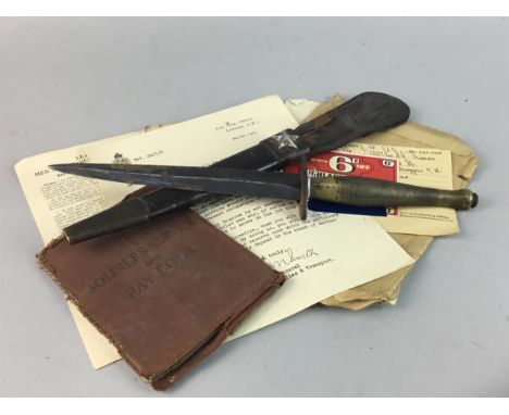 WWII DAGGER, with broad arrow marking, in sheath, along with a collection of soldier's papers including Solidier's Service an