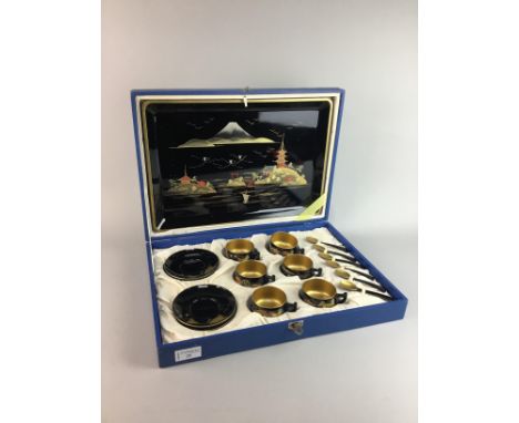 MID 20TH CENTURY LACQUERED WOOD COFFEE SET, comprising six cups, saucers and spoons along with a tray, in a fitted case