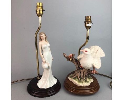 20TH CENTURY FIGURAL TABLE LAMP, modelled as a female holding a hat, 40cm high, along with another decorative figural lamp mo