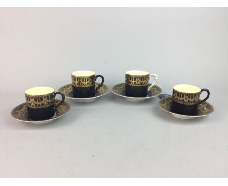 ROYAL WORCESTER COFFEE SERVICE, decorated with bands of gilt over black, comprising eleven cups and twelve saucers, along wit