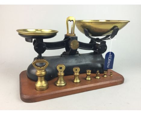 SET OF IRON AND BRASS KITCHEN SCALES WITH WEIGHTS, on a wooden plinth, 35cm wide, along with a brass kettle, Indian brass vas