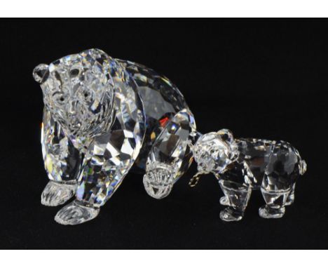 Swarovski crystal glass grizzly bear together with cub holding a fish, boxed. 