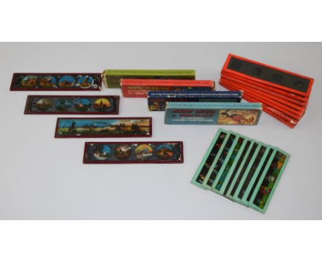 Five sets of Disney magic lantern slides, four in original boxes, comprising 'Mickey Mouse in Pigmyland', 'Santa's Workshop',