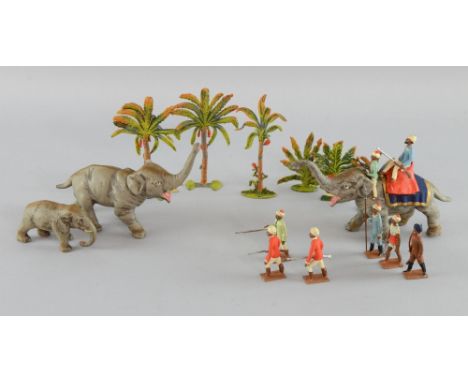Cast metal set of Elephant hunting figures, Arabian soldiers and six palm trees,   