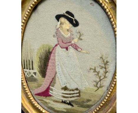 19th century oval needlework panel of a young woman holding a flower, 23cm x 16cm 
