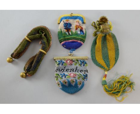 A collection of 19th C beaded purses including misers  purses six purses and a small panel, small floral purse one side detac