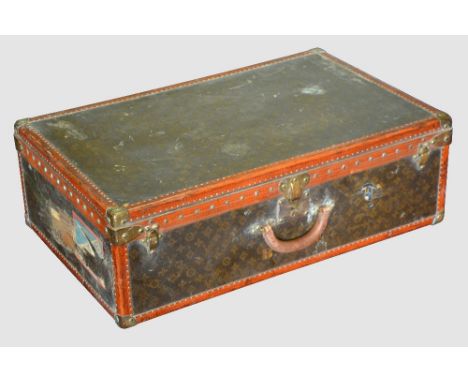 Vintage Louis Vuitton suit case in typical form with monogramed decoration,  lable numbered 812122 plane silk intertior  lack