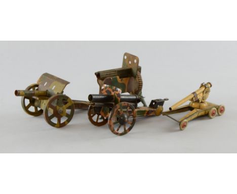 Three tin plate model field guns and another of a machine gun, Play worn.