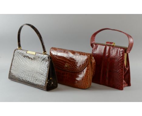 Three Vintage crocodile and snake skin handbags, a mid brown 1930's crocodile skin bag, dark brown crocodile bag, 1960's and 