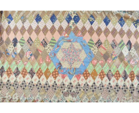 19th century quilt constructed with printed cotton dress fabrics in diamond forms, 49cm x 71cm,  Marjority very good conditio