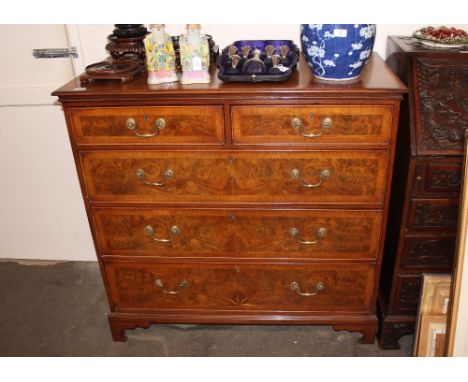 A large 18th Century style walnut and herringbone banded chest, of two short and three long drawers, decorated with inlaid st