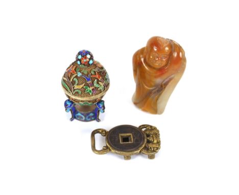 A small butterscotch soapstone carving of a laughing boy, 6.5cm; a small silver gilt and enamel box and cover with filigree d