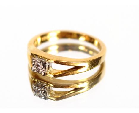 An 18 carat gold and diamond set ring, size K