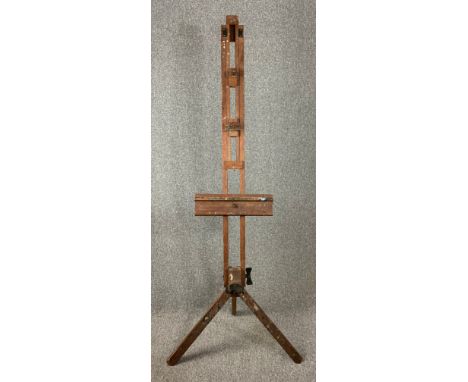 A vintage beech framed artist's studio easel by Winsor and Newton. H.183cm 