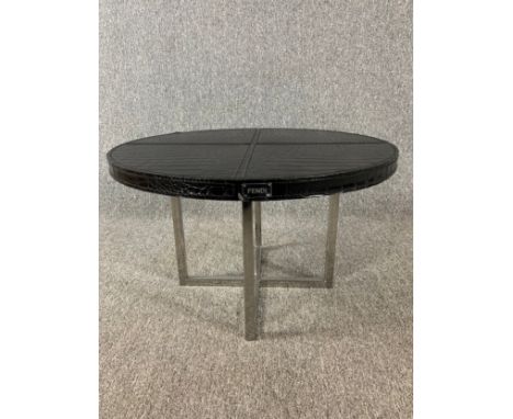 A contemporary Fendi faux crocodile skin coffee table on chrome base. H.38 Dia.61cm 