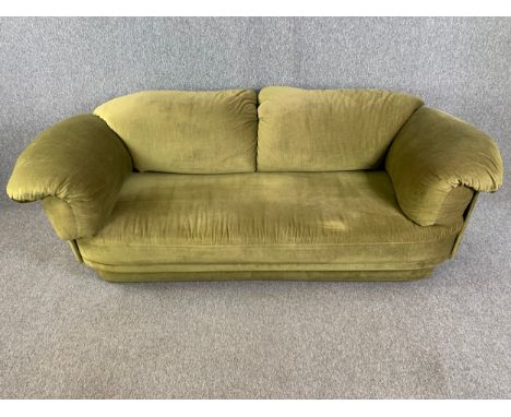 A mid century Heal's two seater sofa upholstered in velour. H.80 W.234 D.100cm 