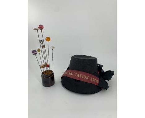 A vintage ladies Salvation Army hat and a collection of vintage hat pins. Dia.21cm (largest) 