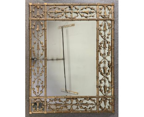 A large vintage gilt metal wall mirror in 19th century style with husk and ribbon decoration.  H.157 W.206cm 