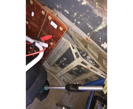 A Workmate work bench and a ceramic tile cutter. 