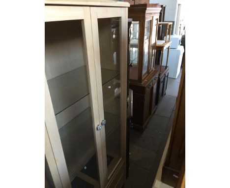 A modern light wood effect glazed display cabinet with two lower drawersCondition: no signs of any damage or repairs, all gla