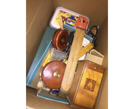 Box of items inc. leather measuring tapes, vintage rules wooden box etc. 