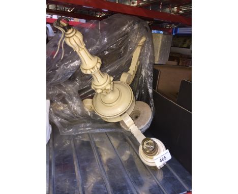 A white painted ceiling light fitting. 