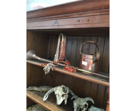 A copper hunting horn, a bugle and a copper watering can. 