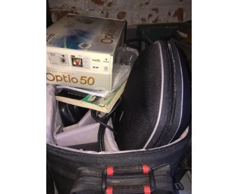A camera bag with contents, to include cameras, accessories, docking station, etc. 