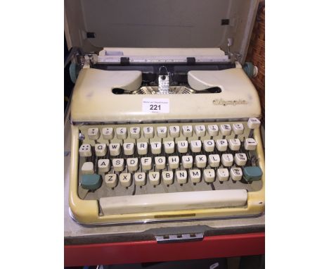 A vintage Olympia portable typewriter.Condition:- General wear through age and use, no signs of any damage or repair, hard ca