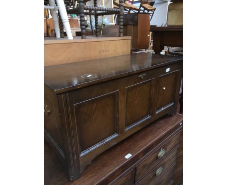 An oak bedding trunk with twin brass handles and escutcheon 