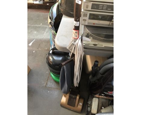 A vintage Hoover Jr upright vacuum cleaner. 