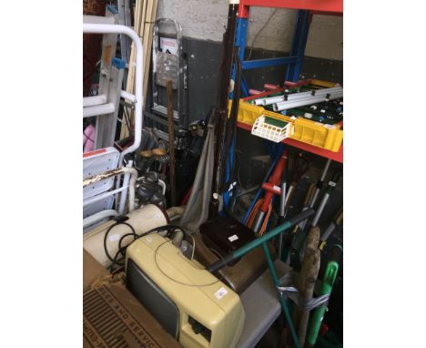 A vintage Hoover Senior 612, a Goblin vax, and a TV. 