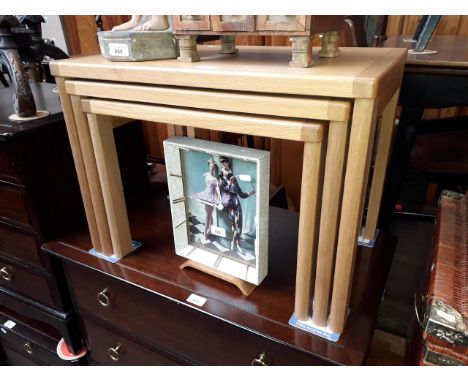 A modern light oak nest of tables 