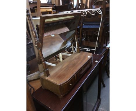 A George III mahogany toilet mirror with turned supports, three drawer base and stood on bracket feet.Condition: break/repair