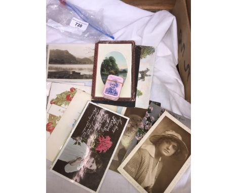 A bag of vintage postcards and miniture playing cards 