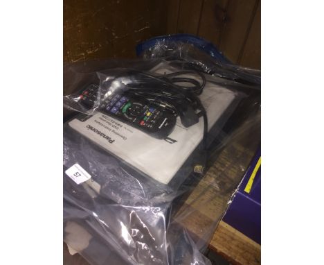 A Panasonic DVD recorder with manual and remote. 