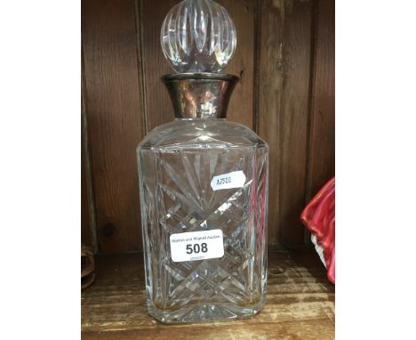 Glass decanter with silver collar 